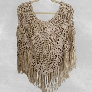 Crochet poncho with fringe detail